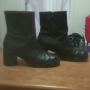 Black high heeled boots.